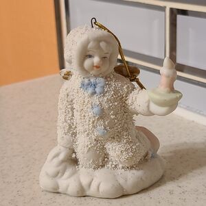 Snowy Figurine with Blue Accents